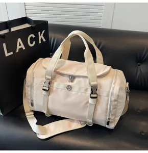Beige large capacity gym duffel bag, lightweight waterproof travel bag with wet dry separation.