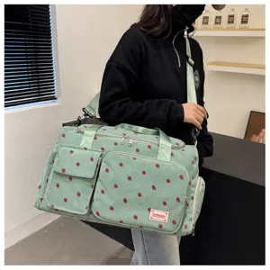 Cute strawberry corduroy travel duffel bag for women, large capacity shoulder messenger bag.