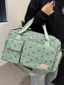 Cute corduroy travel duffel bag with strawberry print, large capacity weekend luggage bag for women.