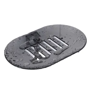 Wall-mounted soap dish with drainage holes, plastic soap holder for bathroom shower storage.