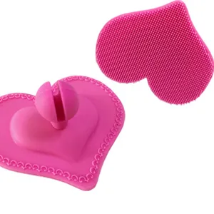Pink heart-shaped silicone facial cleansing brush for deep cleaning makeup removal.
