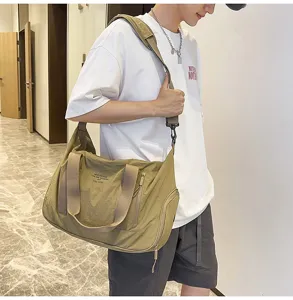 Detail shot of large capacity canvas messenger bag with durable strap and waterproof fabric.