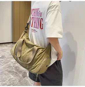 Large capacity waterproof nylon duffel bag for daily travel, gym, and outdoor sports use.