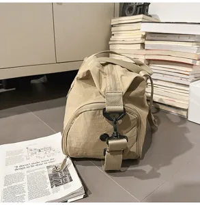 Khaki large capacity nylon duffel travel bag detail, waterproof design for sports and outdoor.