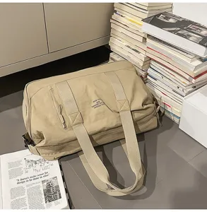 Large capacity beige travel duffel bag for students, versatile shoulder bag for outdoor fitness.