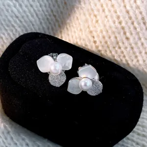 Exquisite flower pearl earrings with mother of pearl petals and sparkling zircons for women.