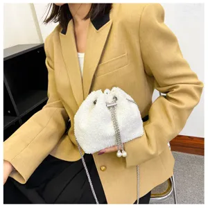 White plush drawstring bucket bag with chain strap, soft fluffy crossbody handbag for women.