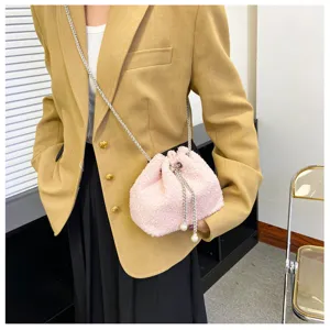 Pink fluffy plush drawstring bucket bag with chain strap and pearl pendants for women.