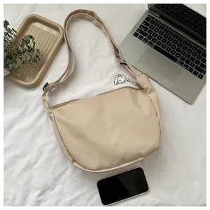 Minimalist corduroy dumpling shoulder bag, casual chic crossbody bag for women daily use.