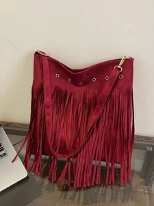 Red suede fringe shoulder bag for women, large capacity casual crossbody bag with metal details.