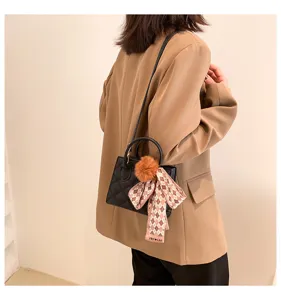 Stylish black quilted shoulder crossbody bag with pom-pom and scarf for women daily commute