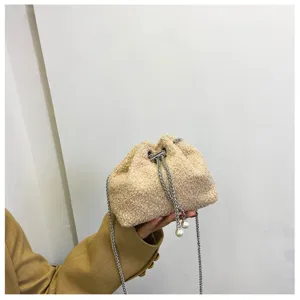 Fluffy plush drawstring bucket bag with chain strap and elegant pearl pendants for women