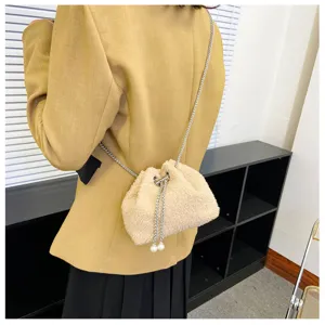 Stylish plush drawstring bucket bag with metal chain strap and pearl details for daily wear.