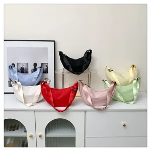 Detailed view of colorful nylon crescent bags showcasing quality fabric and colors.