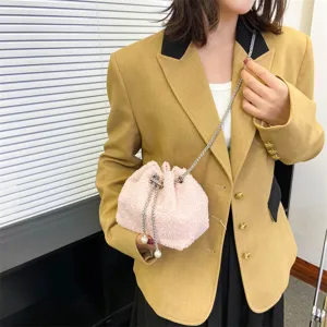 Stylish fluffy plush bucket bag with chain and pearl details for women casual wear.