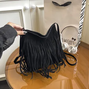 Black suede fringe shoulder bag for women, stylish crossbody handbag for daily commuting.
