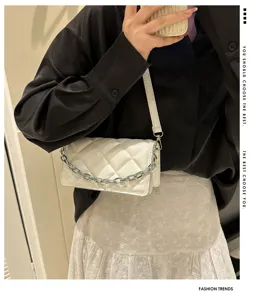 White quilted chain shoulder bag for women, elegant fashion underarm purse with metal strap.