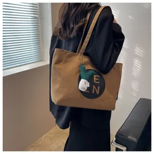 Large capacity canvas shoulder bag for women casual stylish tote bag with cute plush pendant
