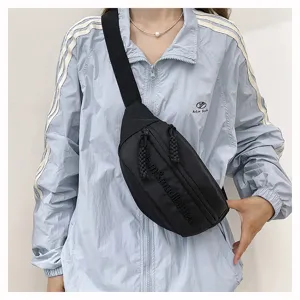 Stylish black streetwear chest bag for men and women, fashion casual crossbody waist bag.
