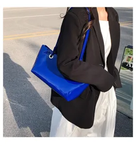 Glossy patent leather blue shoulder underarm tote bag street style detail view fashion accessory
