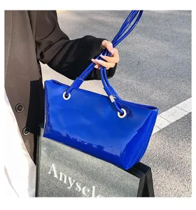 Glossy blue patent leather tote bag, elegant shoulder underarm bag for daily commute fashion.