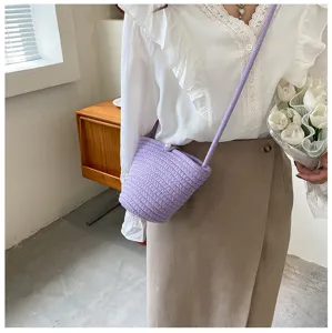 Purple woven bucket bag detail view, stylish cross-body accessory for women's daily casual wear.