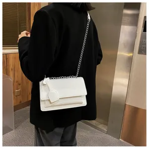 White crocodile pattern crossbody chain bag detail view, stylish casual women shoulder handbag.