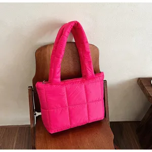 Bright pink quilted puffer tote bag for women, stylish winter casual shoulder handbag.