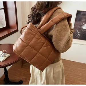 Brown quilted puffer shoulder bag for women, soft down cotton trendy underarm bag for winter daily wear.