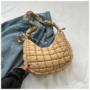 Beige quilted cloud hobo bag, soft puffer shoulder bag with stylish gathered strap design.