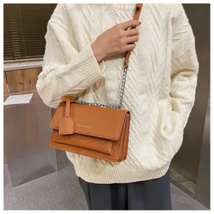 Brown crocodile pattern shoulder bag for women, stylish crossbody chain bag with flap design.