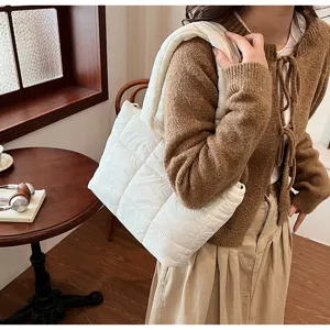 White quilted puffer tote bag for women, stylish down cotton shoulder handbag for winter.