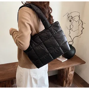 Black quilted puffer shoulder bag for women, trendy winter down cotton casual tote bag.