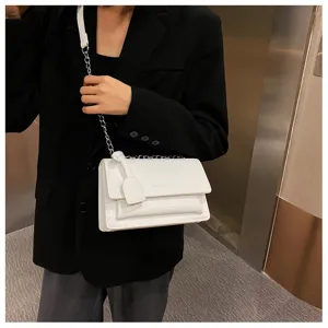 White crocodile pattern chain shoulder bag for women, stylish minimalist crossbody bag detail.