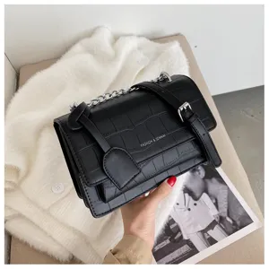 Black crocodile pattern crossbody shoulder bag for women, stylish faux leather chain purse.