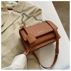 Stylish women's brown crocodile pattern shoulder crossbody bag with metal chain strap.