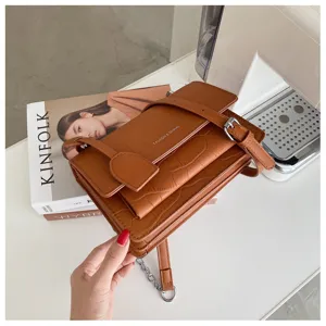 Brown crocodile pattern crossbody bag with metal chain and buckle, stylish women's shoulder bag