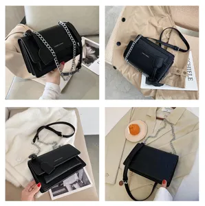 Black crocodile pattern PU leather shoulder bag with metallic chain strap and flap design.