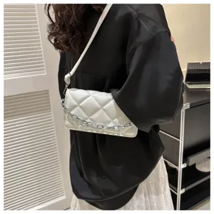 Chic white quilted shoulder bag with chain strap, stylish underarm design for women.