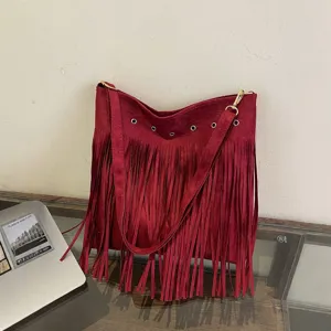 Red suede fringe shoulder bag for women, large capacity casual crossbody bag with tassels.