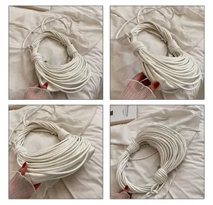 White leather handbag with unique knotted noodle strap design, trendy shoulder bag for women.