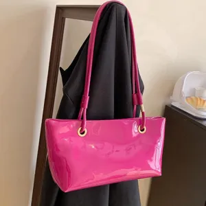 Stylish glossy patent leather tote bag for women, chic shoulder bag for daily office commute.