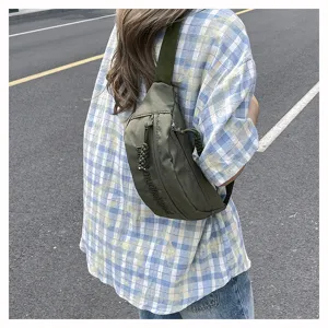 Detail shot of the stylish street trend solid color chest bag, showing durable nylon fabric and zipper.