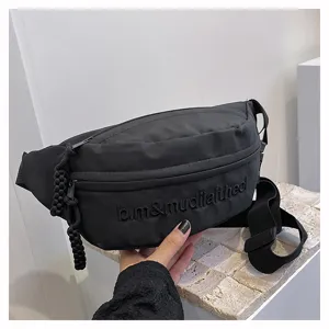 Black casual chest bag for daily wear, featuring stylish front embroidery and durable strap.
