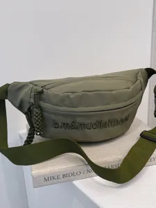 Street fashion solid color chest bag, casual unisex waist bag with letter embroidery for daily wear.