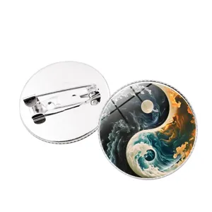 Close-up view of the wave yin-yang glass dome brooch detail and secure pin back clasp.