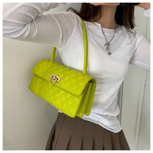 Stylish lime green quilted shoulder bag for women, trendy baguette purse with secure lock.