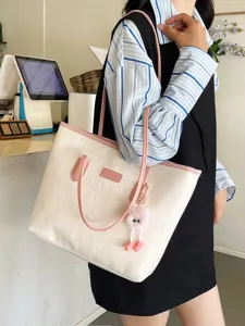 Stylish contrast tote bag for women, large capacity embossed shoulder bag with cute fluffy charm.