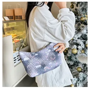 Winter quilted nylon underarm shoulder bag with chic print and gold chain strap detail.