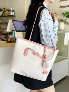 Stylish women large capacity white tote shoulder bag with pink straps and cute charm.